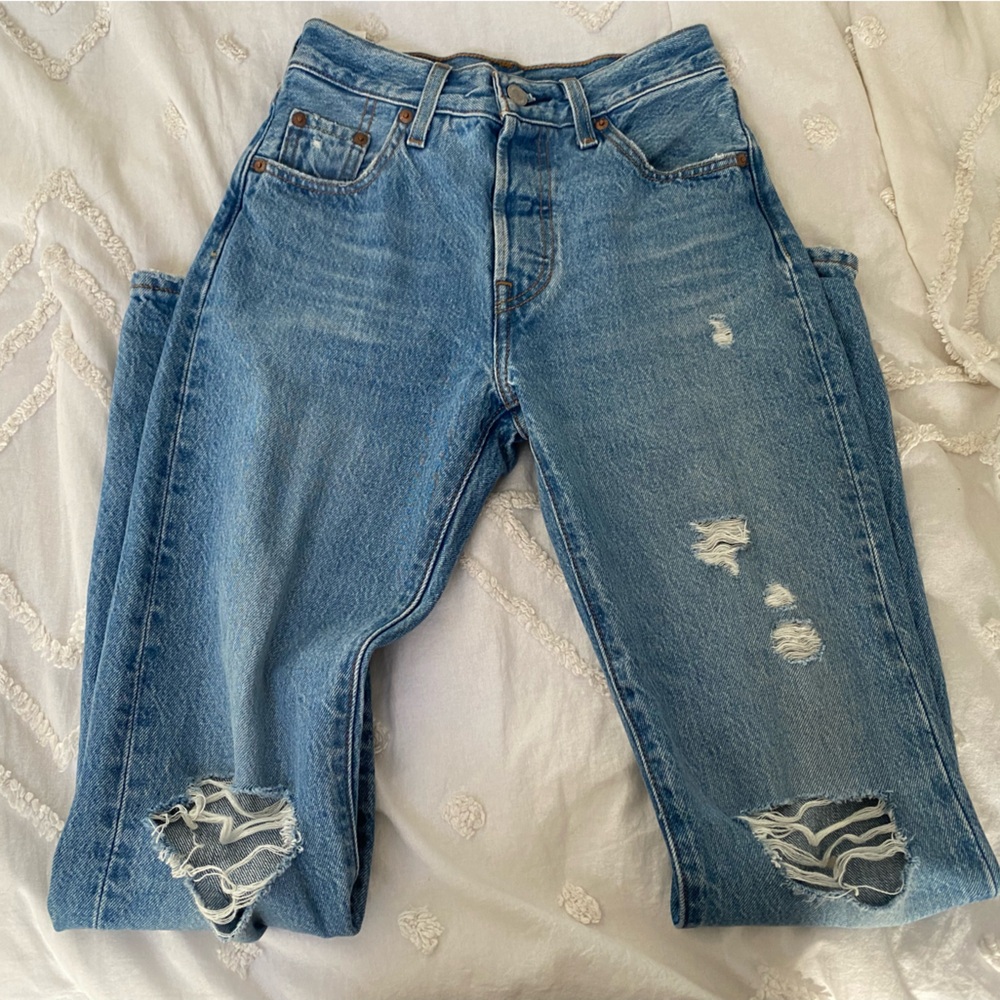 Blue Levi’s 501 jeans ripped